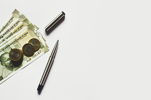image of money and pens